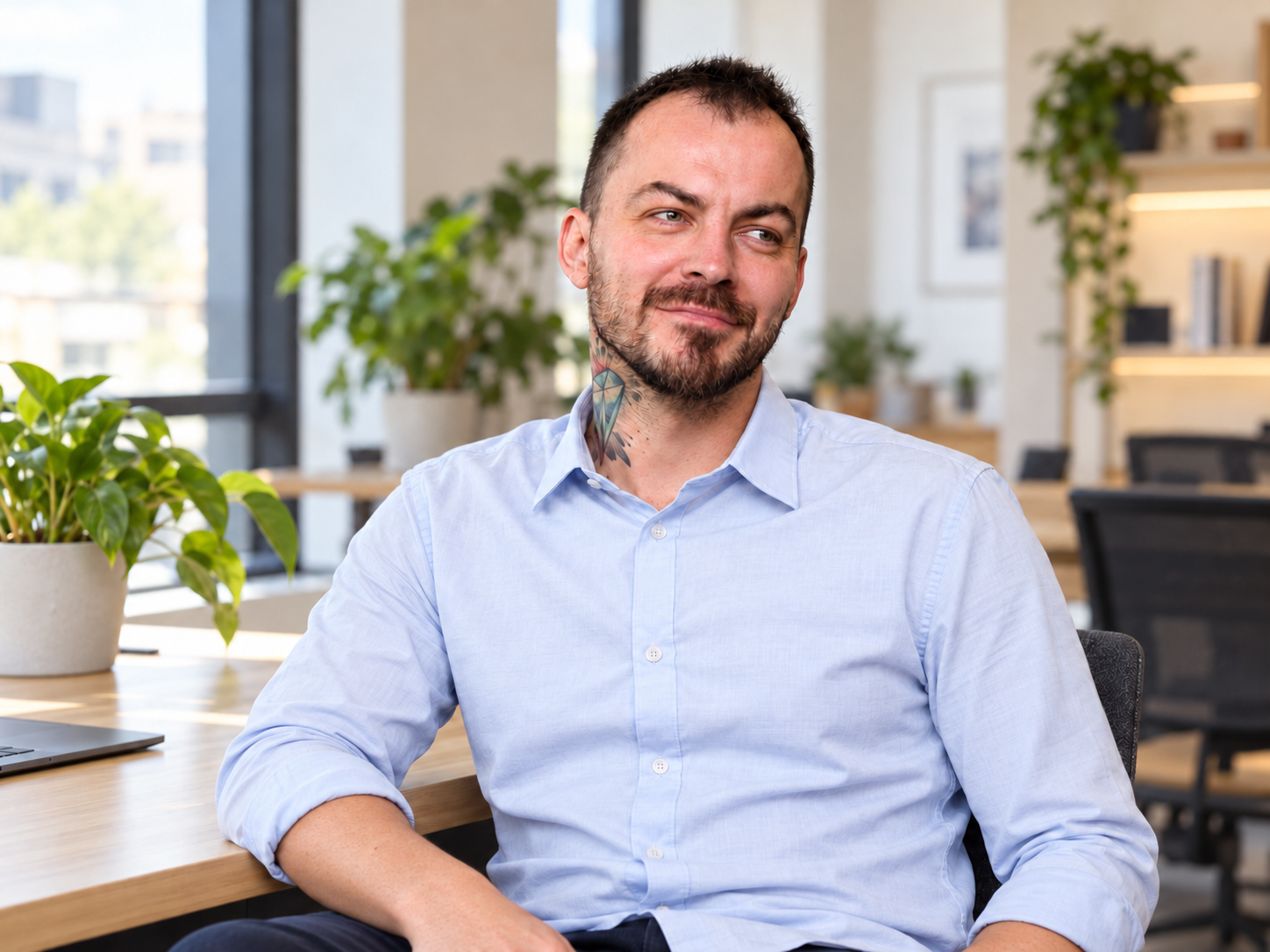 Marcin Pacześny — AI-edited portrait in a bright office