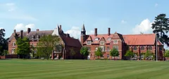 Red-brick Abingdon School buildings behind the lawn, photographed in 2011