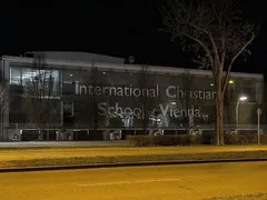 International Christian School of Vienna building at night